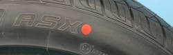 The red dot on a tire indicates the tire&rsquo;s high/stiff point in terms of radial runout. If the tire features both a red dot and a yellow dot, the red dot should be the priority.