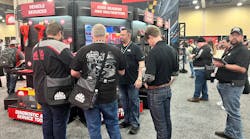 Distributors checking out some of the new Mac Tools diagnostic tools.