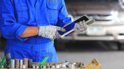 Mechanic With Tools And Tablet